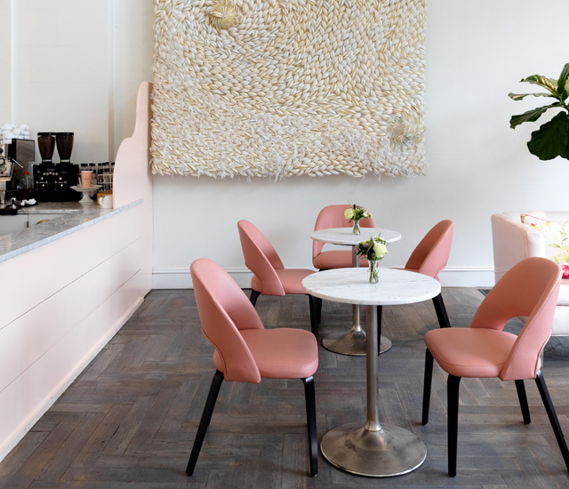 two tables with pink chairs