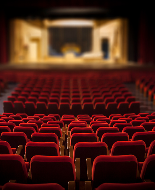 theatre with red chairs 