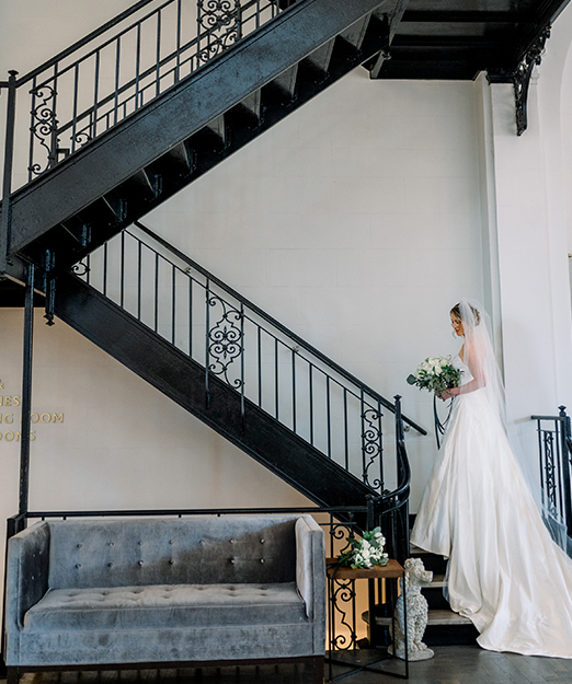 A beautiful bride going upstairs