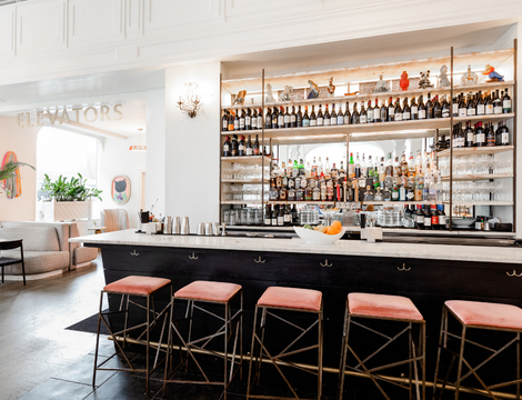 View of the hotel bar with pink stools