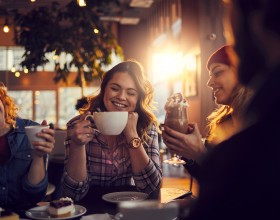 group of women have coffee in a shop