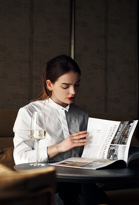 woman reading a menu at the table