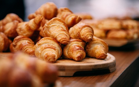 View of a pile of croissants fresh from the oven  