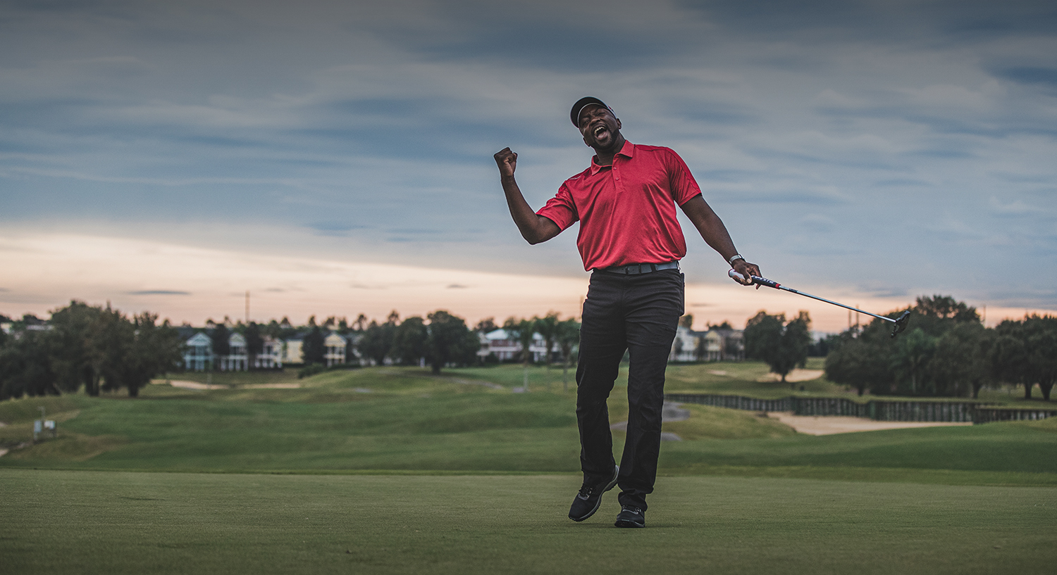 man playing golf excited