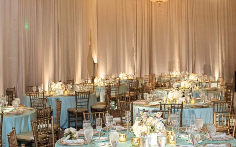 wedding venue set with white tablecloths