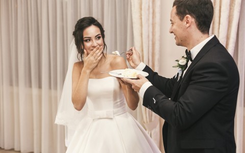 husband feeding wife cake