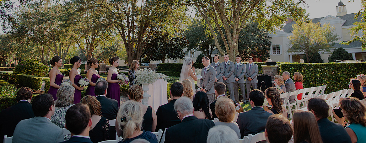 guests sitting watching a ceremony dark overlay
