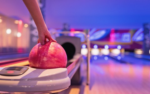 hand reaching for a bowling ball