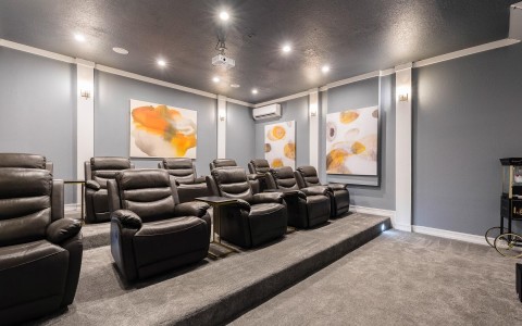 black leather chairs in a private movie theatre