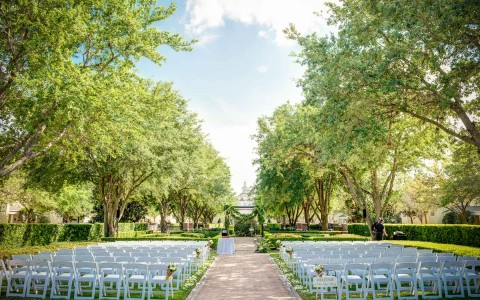 empty chairs prepared for an outside wedding
