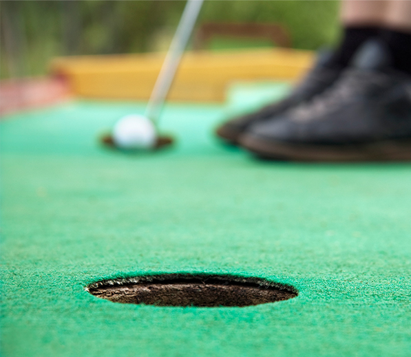 close up of a hole on the mini golf course