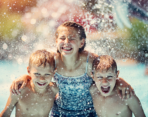 two boys and a girl enjoying the waterpark