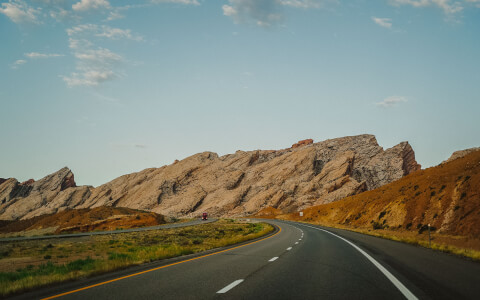 open road with mountains ahead