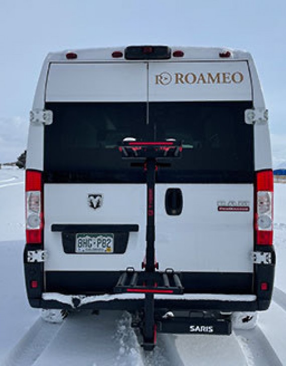 Back view of a van on the snow
