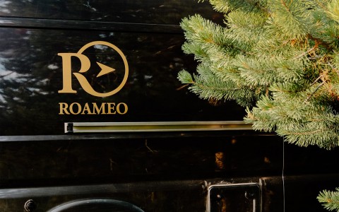 roameo logo on the side of the van 