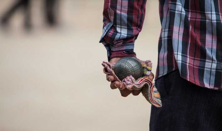 bocceball in man's hand