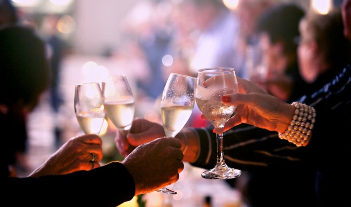 hands toasting with champagne