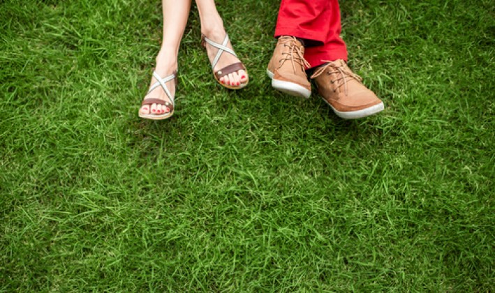 couple's shoes in grass