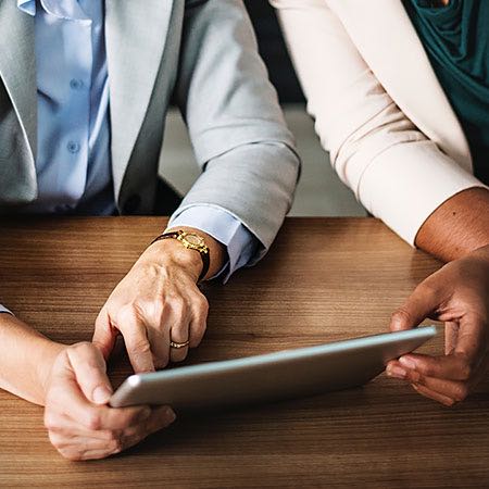 business people looking at a laptop