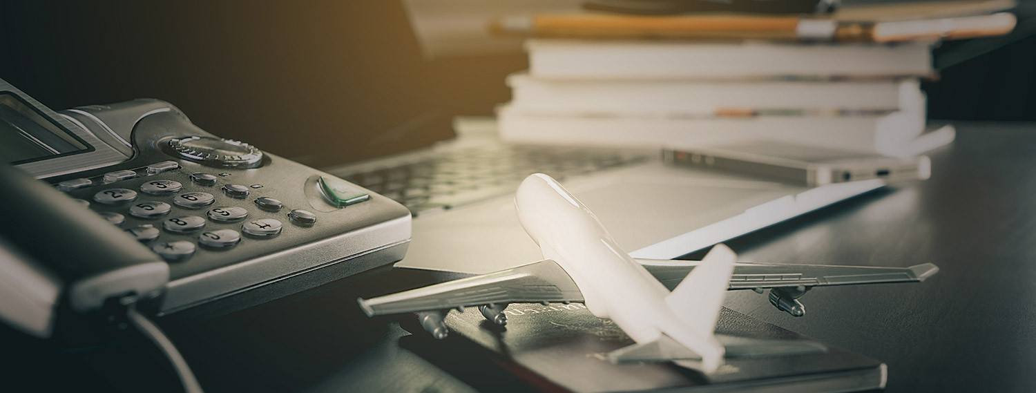 conference phone and airplane figurine