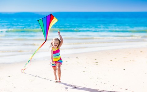 Little Girl on Beach with Kite