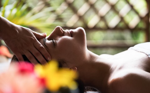 girl receiving a head massage