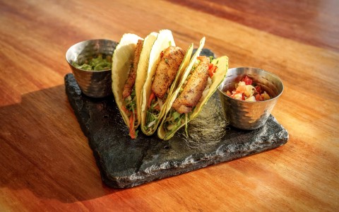fish tacos on a stone plate