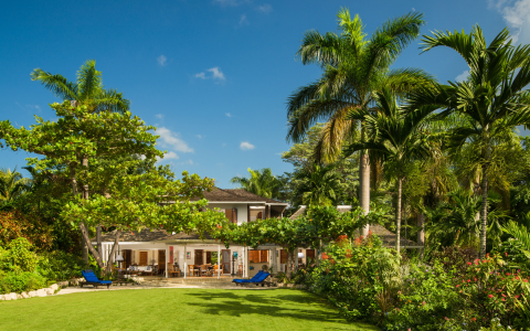 exterior of villa with trees surrounding