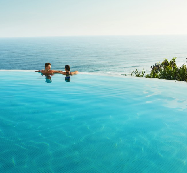 couple in an infinity pool