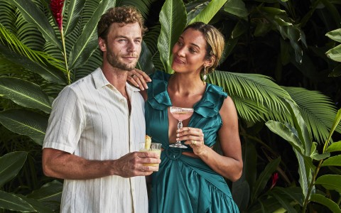 couple with cocktails in their hands