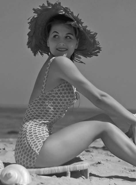 Vintage picture of a beautiful young lady on a classic swimsuit 