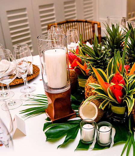 tropical centerpiece with an unlit candle