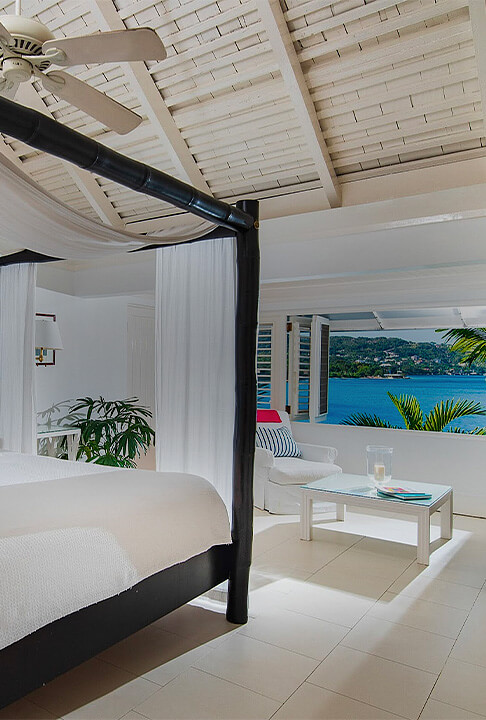 Spacious mostly white bedroom near the ocean
