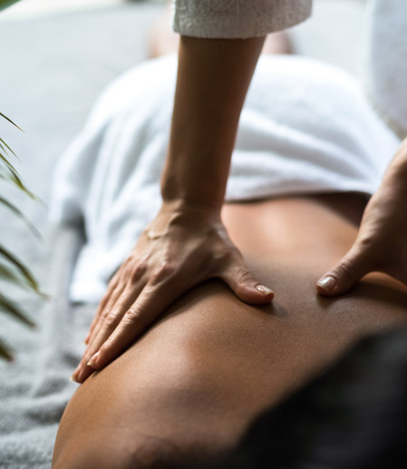 Closeup view of a person getting a back massage 