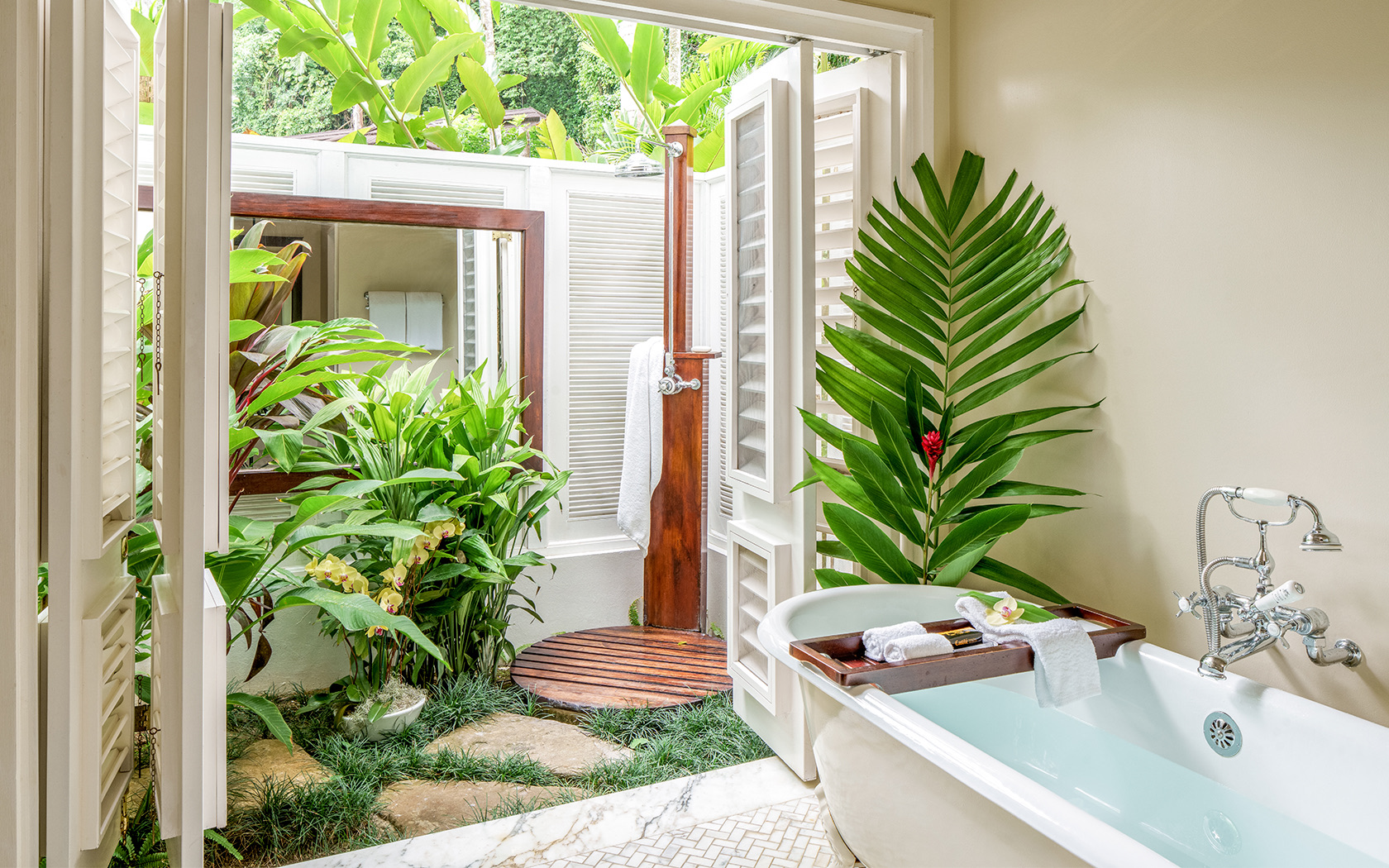 bathroom with outdoor shower and palm leaves