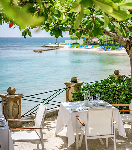 dining table on a terrace on the ocean shoreline