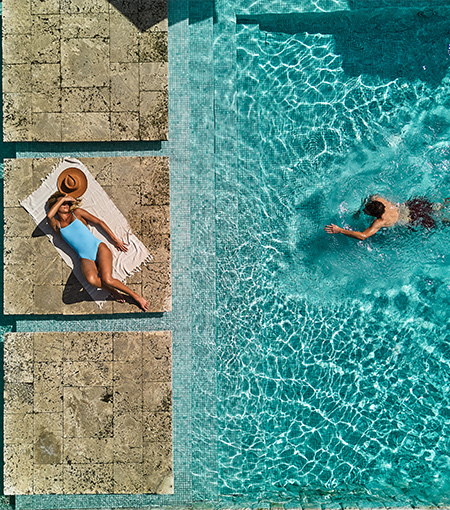 Top view of a woman and a man at the hotel pool
