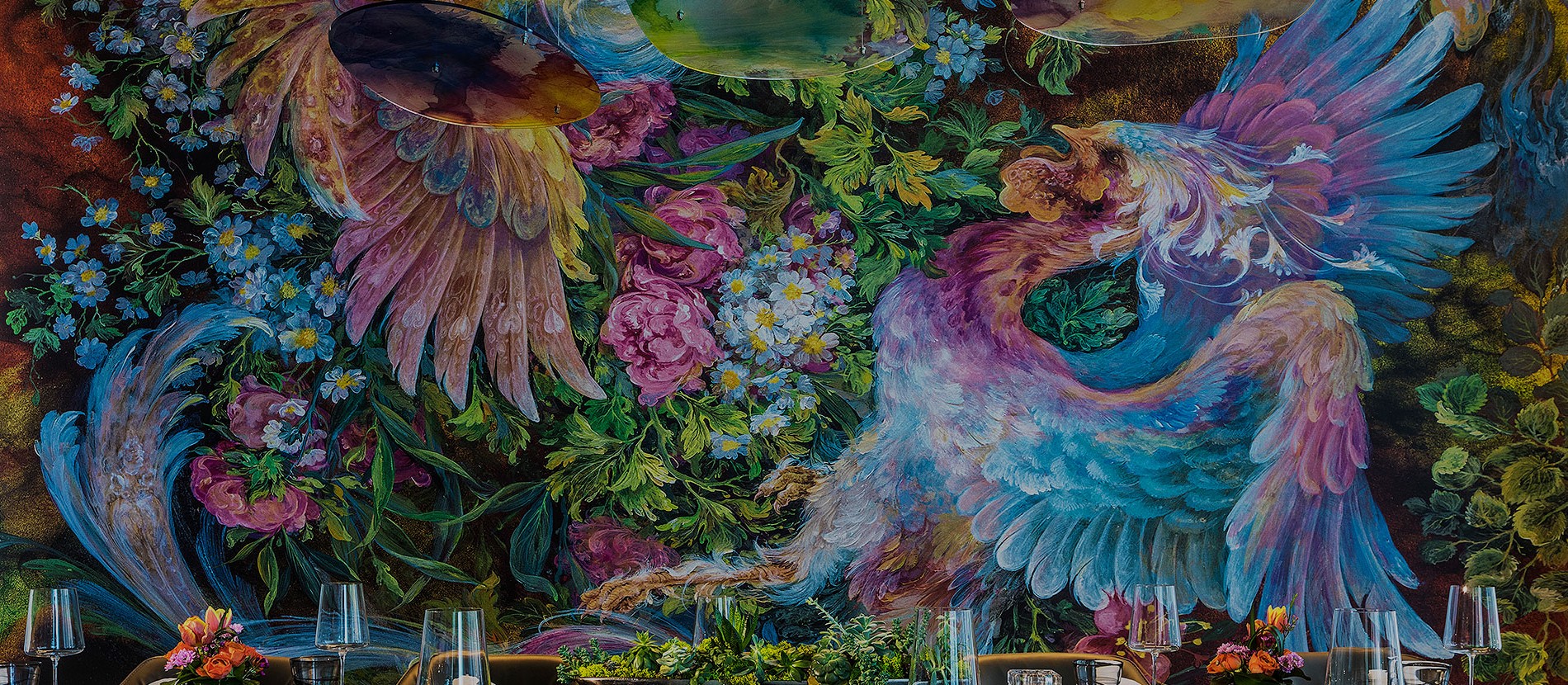 Large colorful mural next to dining table