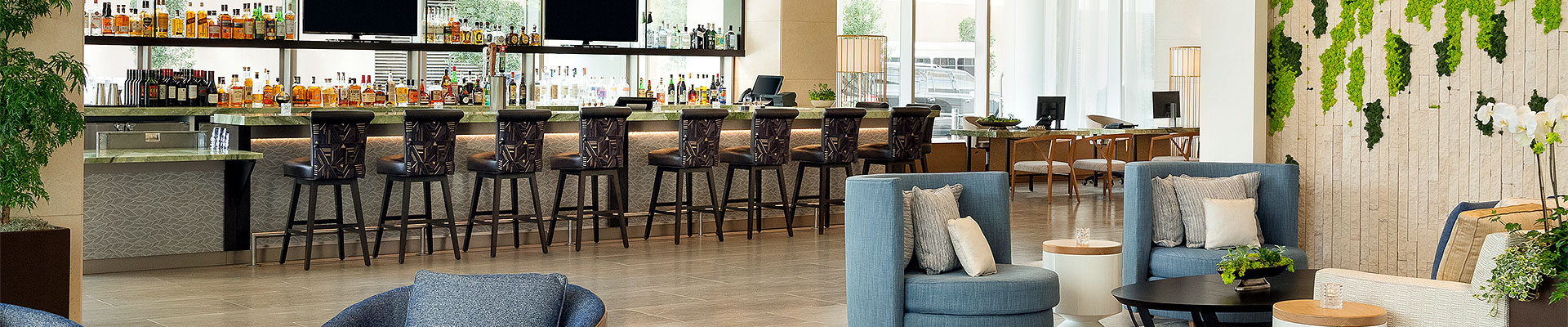 Seating area next to bar with stools