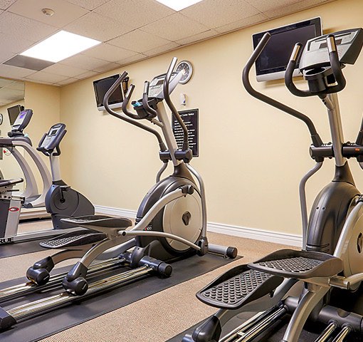 Two stair stepper machines in hotel fitness room