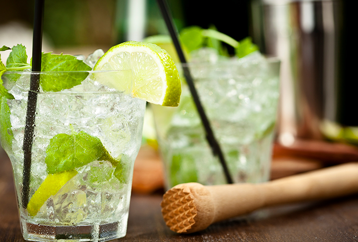 close up of two fresh mojitos cocktails with mint and line