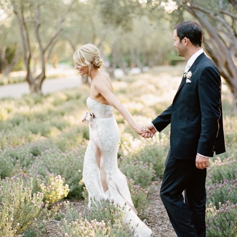 bride and groom strolling in san ysidro garden