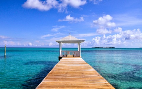 walkway to a kiosk on the water