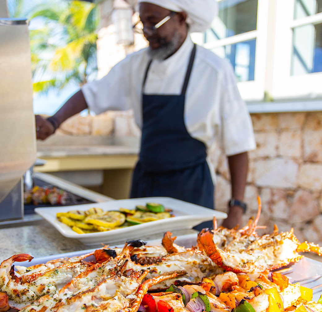 view of a chef cooking some seafood
