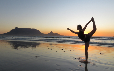 Yoga on beach at sunset
