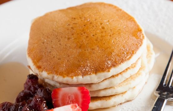 Stack of pancakes and fruit