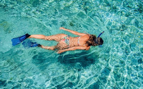 woman snorkling in ocean