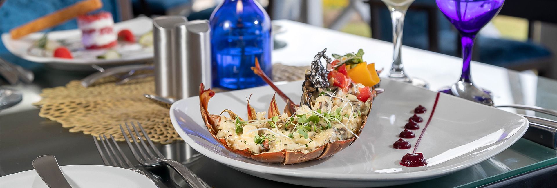 lobster tail on a plate with herbs