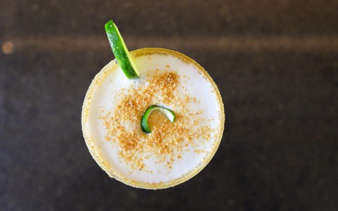 Top view of a beverage with lemon zest