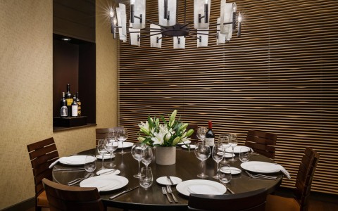 Private dining set table with chandelier on the ceiling